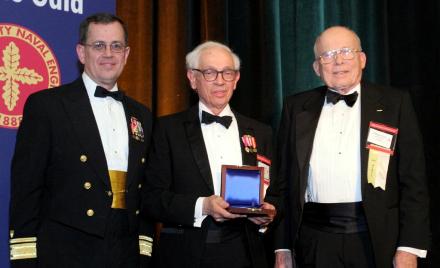 RADM Dale G. Gable, USCG (left) and RADM William C. Wyatt, USN (Ret.) (right) present the Harold E. Saunders Award to CAPT Joseph F. Yurso, P.E., USN (Ret.).